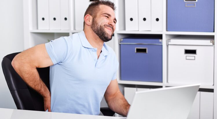 Man with sore back to demonstrate worker's comp claim